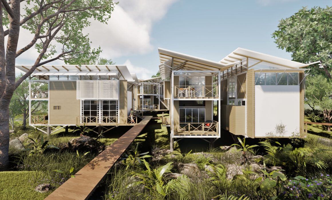Elevated lodge units of Caño Negro Lodge connected by wooden walkways within the Caribbean forest of Cocles, Limón.