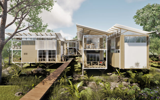 Elevated lodge units of Caño Negro Lodge connected by wooden walkways within the Caribbean forest of Cocles, Limón.